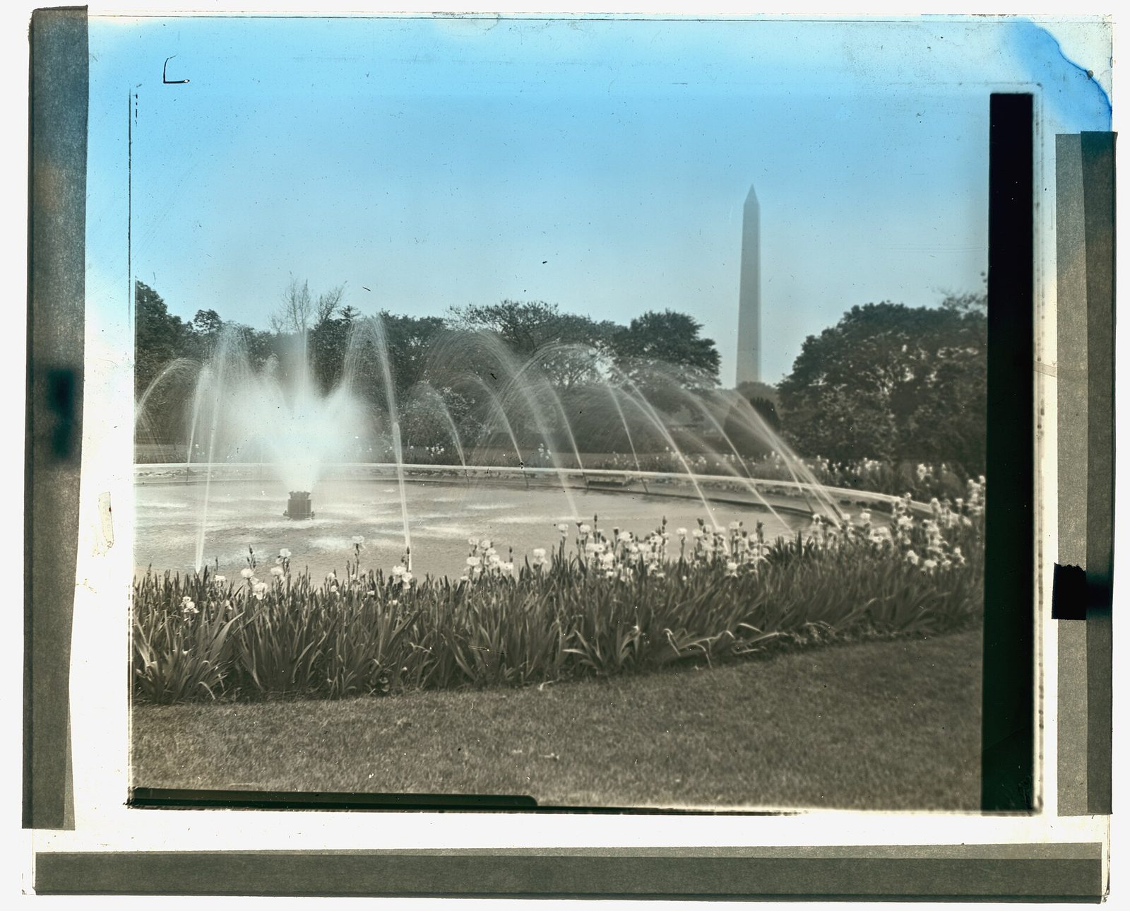 The White House seen from the south lawn, with the Washington Monument in the distance.