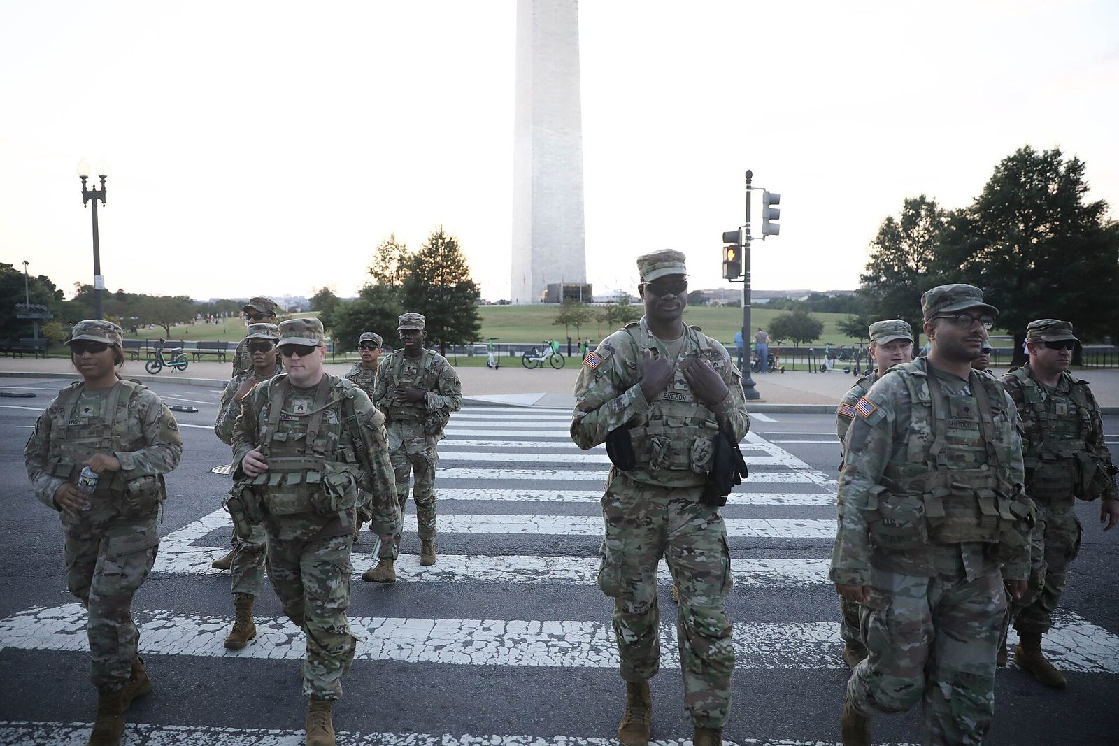 District of Columbia National Guard soldiers on a dismounted patrol crossing a street near the Washington Monument, August 2025.