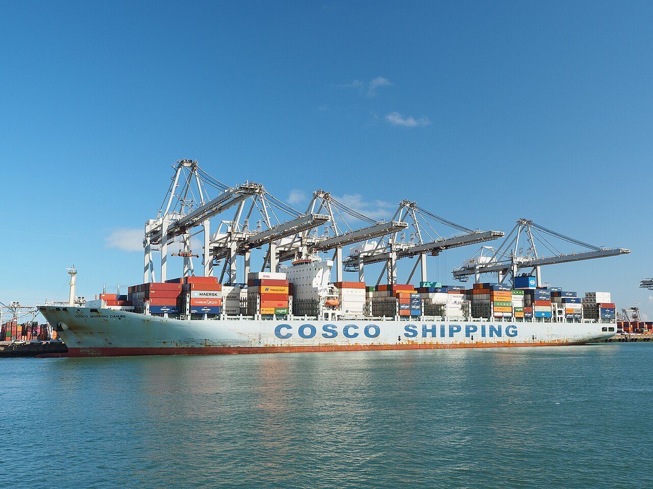 A COSCO Shipping container vessel loaded with cargo containers in the Port of Rotterdam.