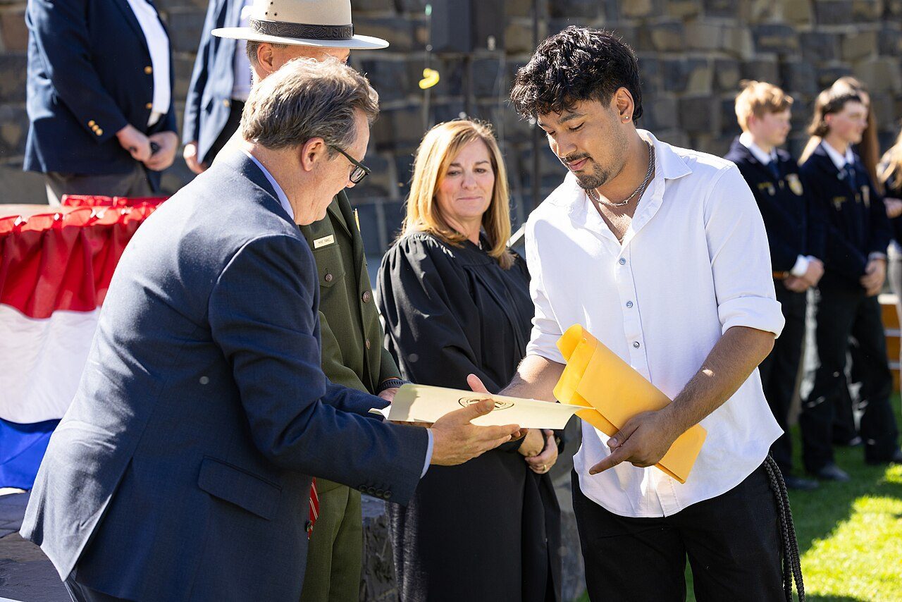 New American citizens at a 2024 U.S. naturalization ceremony.
