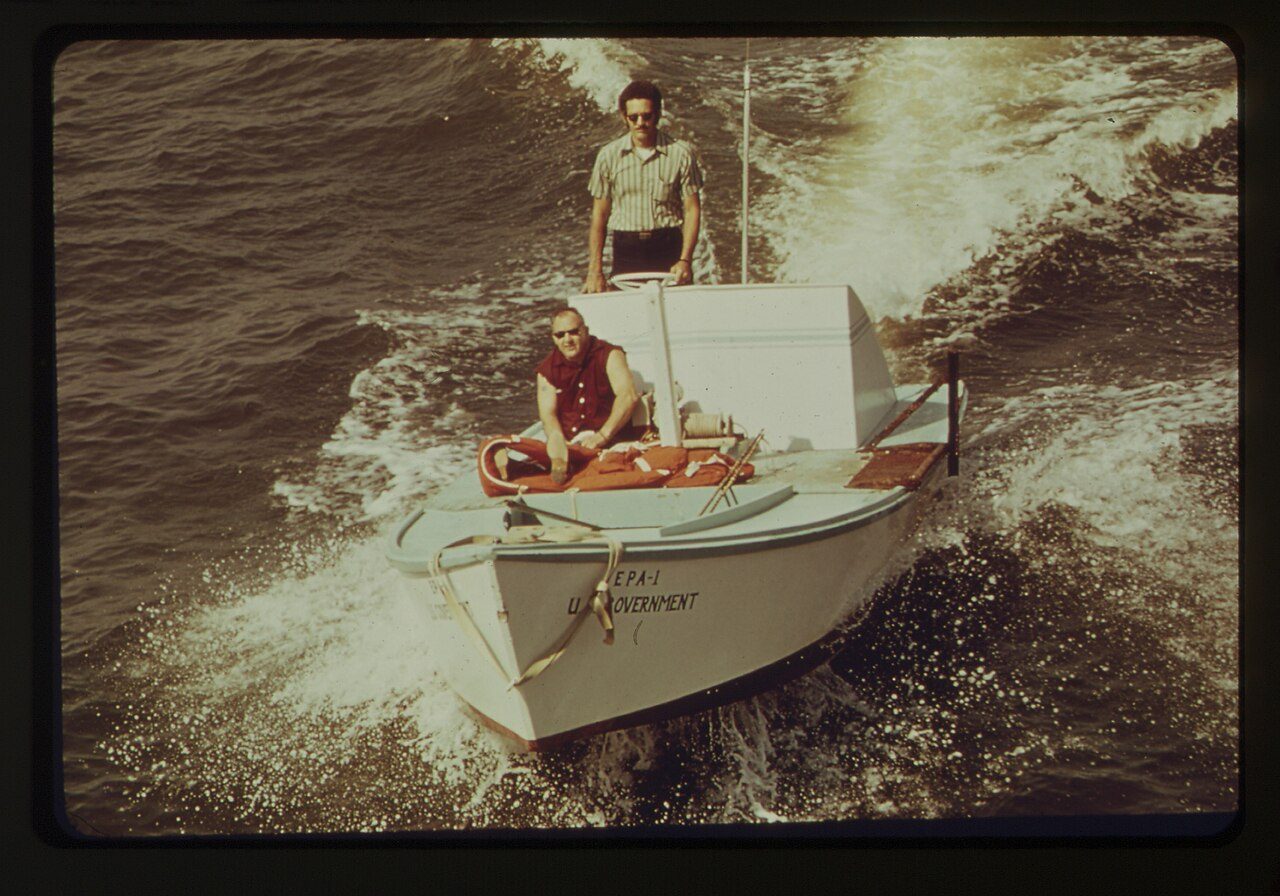 EPA scientists collecting water samples from a research vessel at the agency's Gulf Coast water-supply laboratory.