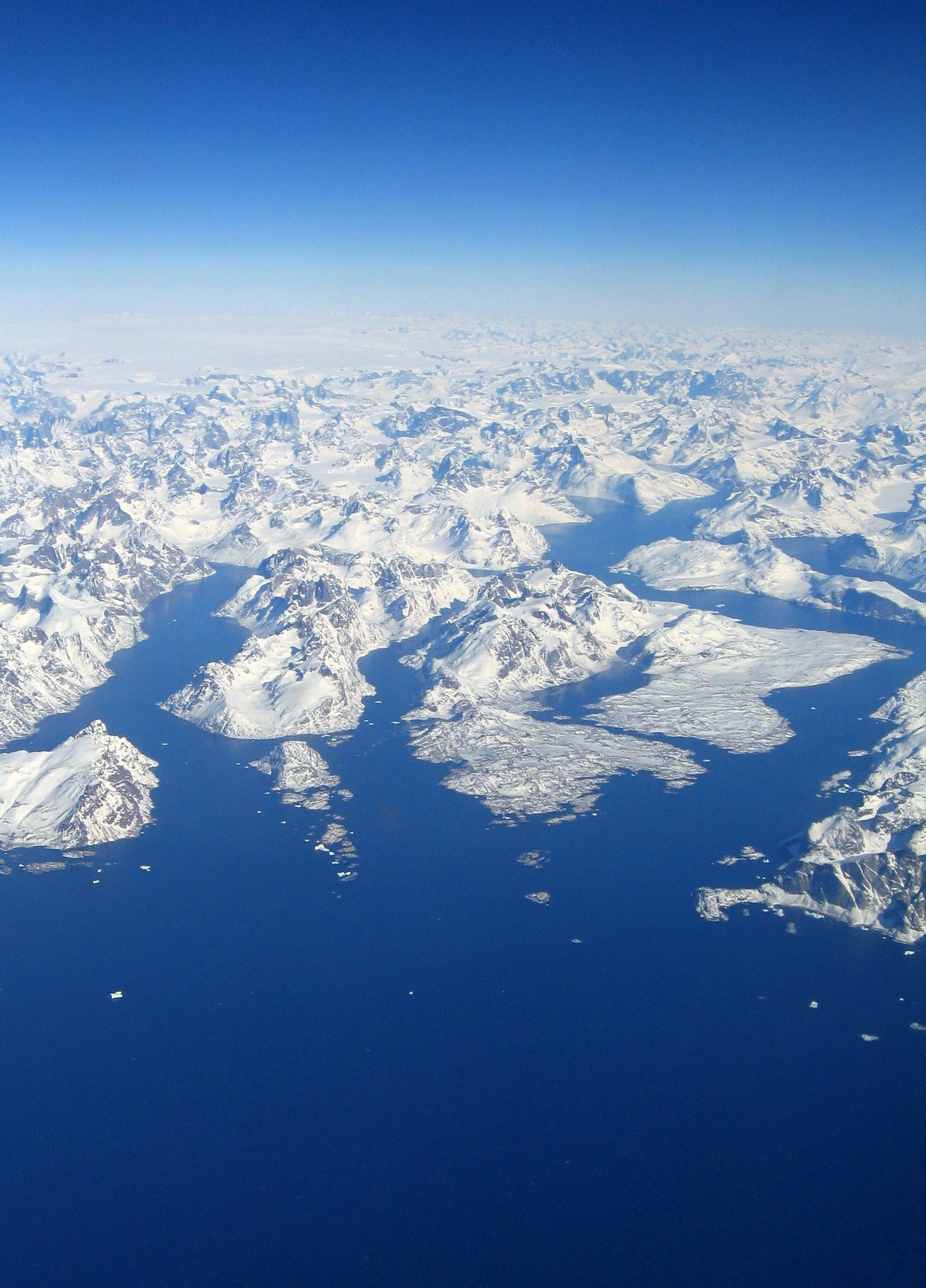 Aerial view of Greenland's Cape Farewell Archipelago showing fjords, mountains and ice