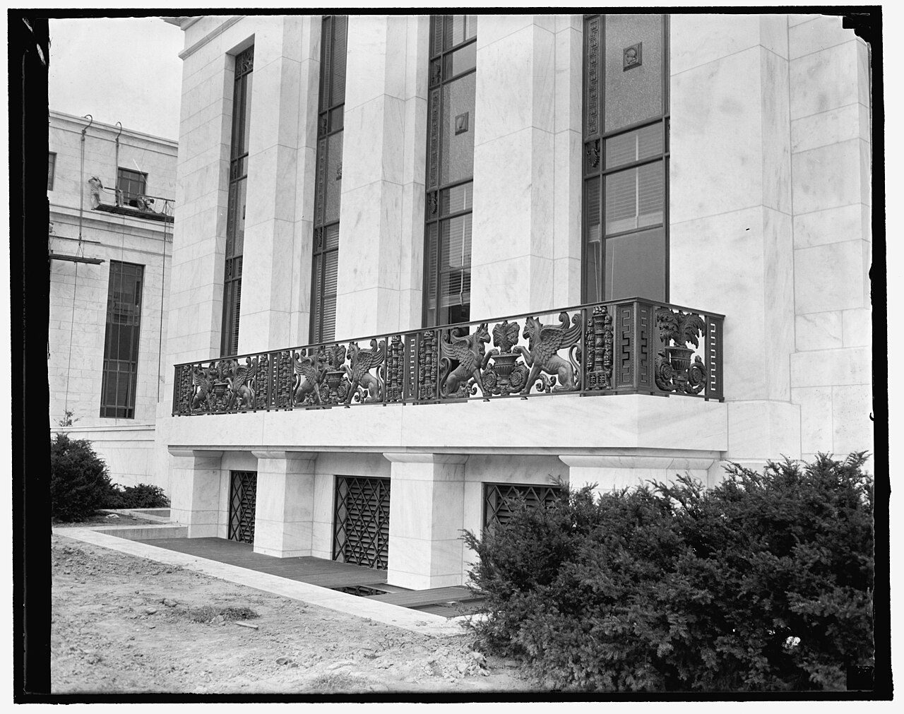 Ornate cast-iron balcony on the marble facade of the Federal Reserve (Marriner S. Eccles) Building in Washington, D.C.