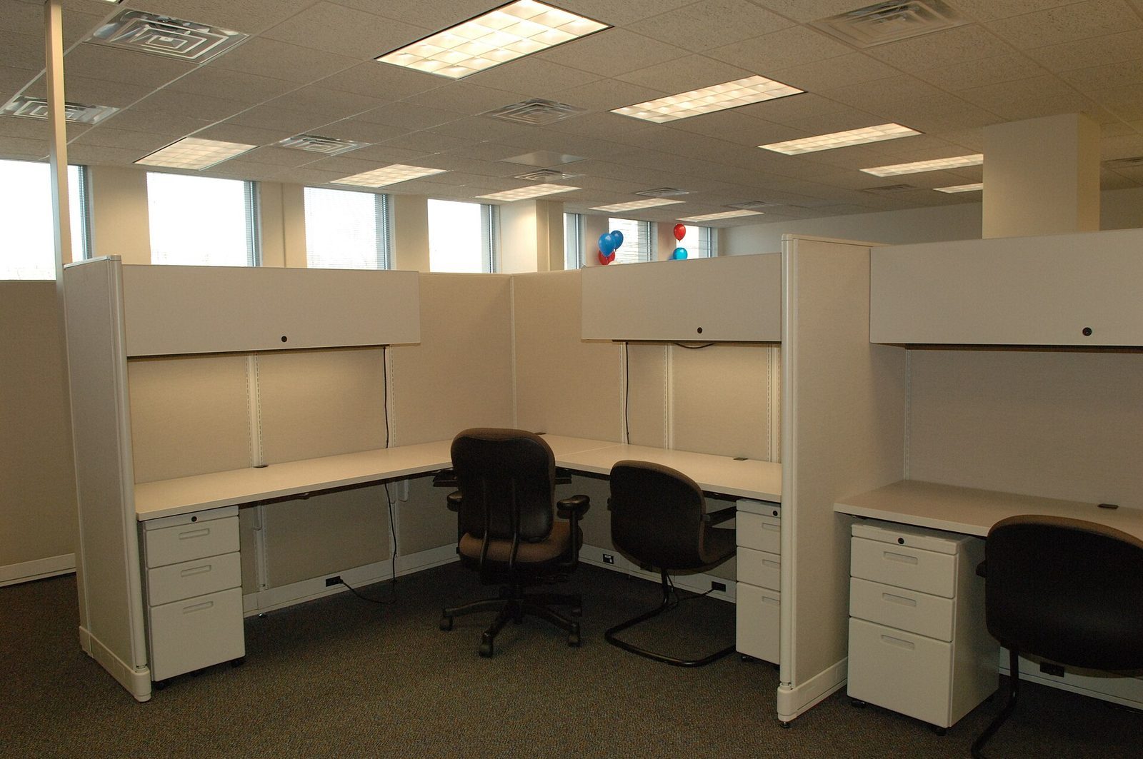 Empty cubicles and desk chairs in an Office of Personnel Management office suite, photographed in 2006.