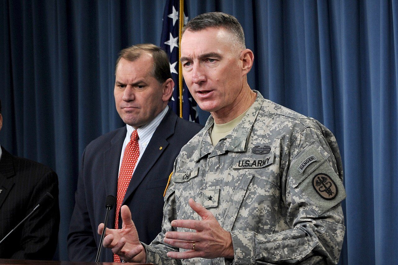 A military official addresses reporters at a Pentagon press conference.