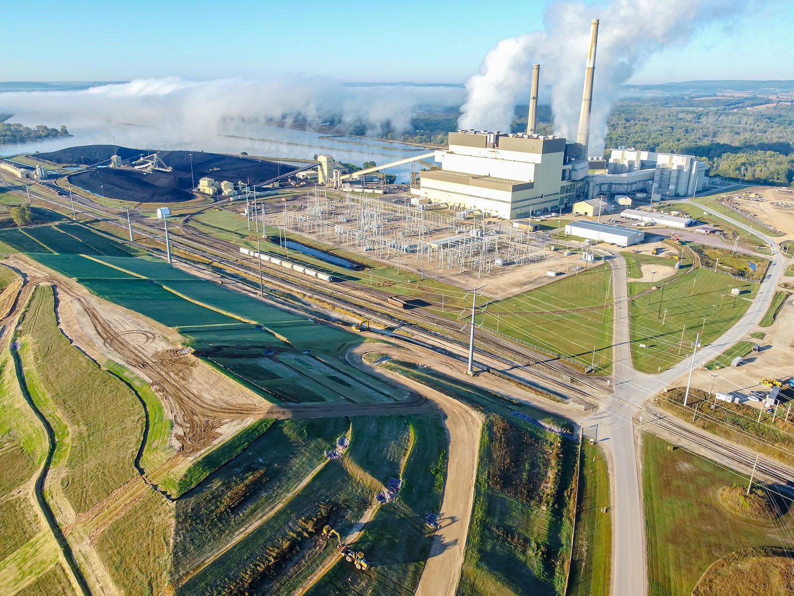 Aerial view of the coal-fired Columbia Energy Center near Portage, Wisconsin, with plumes rising from its stacks.