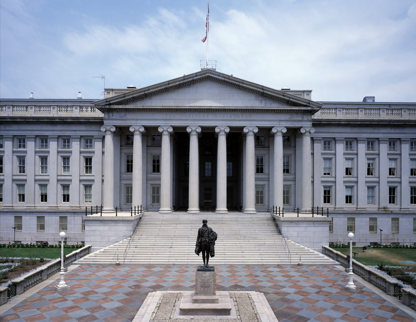 The south front of the U.S. Treasury Department building in Washington, D.C., with the statue of Alexander Hamilton in the foreground.